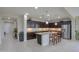 Spacious eat-in kitchen with granite countertops, dark wood cabinets, stainless steel appliances, and center island at 22651 E Via Del Verde --, Queen Creek, AZ 85142