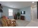 Comfortable living room featuring an entertainment center, plush seating and a well-lit window at 22651 E Via Del Verde --, Queen Creek, AZ 85142