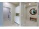Bright mud room featuring white cabinetry and a convenient laundry area with modern washer and dryer at 22651 E Via Del Verde --, Queen Creek, AZ 85142
