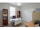 Well-lit office featuring a desk, chair, built-in bookshelves, and carpet flooring at 22651 E Via Del Verde --, Queen Creek, AZ 85142
