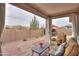Covered patio features brick pavers, desert landscaping, a seating area, and an umbrella table set at 22651 E Via Del Verde --, Queen Creek, AZ 85142