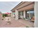 Covered patio with comfortable seating, a water feature, and a landscaped backyard at 22651 E Via Del Verde --, Queen Creek, AZ 85142