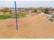Community playground features modern play structure, swings, and green space perfect for outdoor activities and Gathering fun at 22651 E Via Del Verde --, Queen Creek, AZ 85142