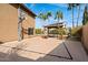 A backyard featuring a basketball hoop, covered pergola and swimming pool at 23225 N 23Rd Pl, Phoenix, AZ 85024