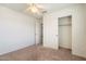 This bedroom features a standard closet and neutral walls at 23225 N 23Rd Pl, Phoenix, AZ 85024