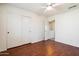 This bedroom features hardwood flooring and a standard closet at 23225 N 23Rd Pl, Phoenix, AZ 85024
