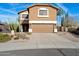 Charming two-story home with a well-manicured front yard, desert landscaping, and a convenient two-car garage at 23225 N 23Rd Pl, Phoenix, AZ 85024