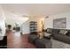 Bright and airy living room with open floor plan, tile floors, and stylish furnishings at 23225 N 23Rd Pl, Phoenix, AZ 85024