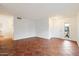 Spacious living room featuring tile flooring, ample natural light, and a welcoming atmosphere at 23225 N 23Rd Pl, Phoenix, AZ 85024