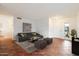 A tastefully decorated living room with tile flooring, a large window, and neutral-toned furniture at 23225 N 23Rd Pl, Phoenix, AZ 85024