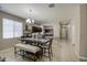 Open-concept dining area showcasing a chandelier and seamless access to the kitchen at 23850 W Levi Dr, Buckeye, AZ 85326