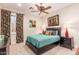 Comfortable bedroom featuring a queen-size bed, colorful accents, and soft lighting at 2455 N Maple --, Mesa, AZ 85215