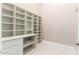 Walk-in closet with custom white shelving and ample storage space at 2455 N Maple --, Mesa, AZ 85215