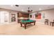 Spacious game room with a pool table, wet bar, and cozy atmosphere for entertaining guests at 2455 N Maple --, Mesa, AZ 85215