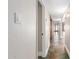 Slate tile hallway with neutral colored walls and decorative sconces at 2510 E Crittenden Ln, Phoenix, AZ 85016