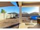 Fenced backyard with a trampoline, swing set, above ground pool and a barbecue grill at 25913 W Cat Balue Dr, Buckeye, AZ 85396