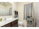 Bathroom featuring a large vanity, tiled floor, and grey cabinets with modern hardware at 25913 W Cat Balue Dr, Buckeye, AZ 85396