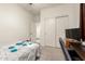Bright bedroom featuring carpeted floors, lots of storage, and a ceiling fan at 25913 W Cat Balue Dr, Buckeye, AZ 85396