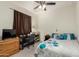 Comfortable bedroom featuring a full sized bed, natural light, and a ceiling fan at 25913 W Cat Balue Dr, Buckeye, AZ 85396
