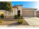 Charming single-story home with a well-manicured yard and inviting entrance at 25913 W Cat Balue Dr, Buckeye, AZ 85396