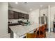 Contemporary kitchen featuring a large island with seating and modern appliances at 25913 W Cat Balue Dr, Buckeye, AZ 85396
