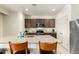 Modern kitchen featuring granite countertops, stainless steel appliances, and ample cabinet space at 25913 W Cat Balue Dr, Buckeye, AZ 85396