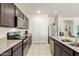 Well-equipped kitchen with stainless steel appliances and ample counter space at 25913 W Cat Balue Dr, Buckeye, AZ 85396