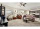 Spacious living area with neutral tones, multiple seating options, and natural light at 25913 W Cat Balue Dr, Buckeye, AZ 85396