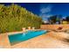 Enjoy the luxurious private pool with rock water feature, surrounded by lush landscaping for ultimate privacy at 26711 N 21St Dr, Phoenix, AZ 85085