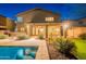 The backyard features a private pool, covered patio, and lush landscaping, perfect for outdoor living and entertaining at 26711 N 21St Dr, Phoenix, AZ 85085