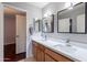 Bathroom with double sink vanity, framed mirrors, and plenty of lighting, perfect for a modern look at 26711 N 21St Dr, Phoenix, AZ 85085