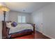 Comfortable bedroom featuring a full size bed, hardwood floors, and ample natural light at 26711 N 21St Dr, Phoenix, AZ 85085