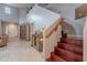 Entryway featuring a staircase, built-in bookshelves, and a decorative bar area at 26711 N 21St Dr, Phoenix, AZ 85085