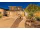 Beautiful two-story home with a spacious driveway and lush desert landscaping at 26711 N 21St Dr, Phoenix, AZ 85085