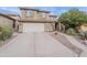 Lovely two story home boasting a charming exterior, three-car garage, and low-maintenance desert landscaping at 26711 N 21St Dr, Phoenix, AZ 85085