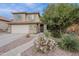 Charming home featuring desert landscaping, enhancing curb appeal and blending with the natural surroundings at 26711 N 21St Dr, Phoenix, AZ 85085