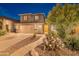 Charming two-story home with a spacious driveway and meticulously manicured desert landscaping at 26711 N 21St Dr, Phoenix, AZ 85085