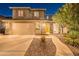 Inviting front entrance features well-manicured desert landscaping, adding to the home's curb appeal at 26711 N 21St Dr, Phoenix, AZ 85085