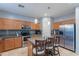 Modern kitchen boasts sleek countertops, a stainless steel refrigerator, and a functional central island at 26711 N 21St Dr, Phoenix, AZ 85085