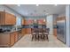 Well-equipped kitchen featuring sleek countertops, a central island, stainless steel appliances, and ample storage at 26711 N 21St Dr, Phoenix, AZ 85085