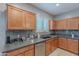 Functional kitchen featuring stainless steel appliances, granite countertops, and modern tile backsplash at 26711 N 21St Dr, Phoenix, AZ 85085