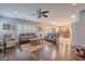Large living room with hardwood floors, neutral paint, and open access to the kitchen at 26711 N 21St Dr, Phoenix, AZ 85085