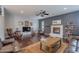 Inviting living room with a cozy fireplace and comfortable seating arrangement at 26711 N 21St Dr, Phoenix, AZ 85085