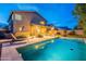 Backyard pool offers a relaxing oasis, complemented by a covered patio and lush greenery at 26711 N 21St Dr, Phoenix, AZ 85085