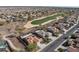 Aerial view of community featuring a golf course, desert landscaping and single-story homes at 27248 W Mohawk Ln, Buckeye, AZ 85396
