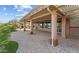 Covered back patio with pavers and decorative pillars offering an excellent space for entertaining at 27248 W Mohawk Ln, Buckeye, AZ 85396