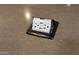 Close-up of a countertop with a pop up outlet and USB ports at 27248 W Mohawk Ln, Buckeye, AZ 85396