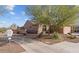 View of the home's side and front, with desert landscaping and a view of the desert community at 27248 W Mohawk Ln, Buckeye, AZ 85396