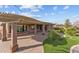 Spacious covered patio with pavers, offering a great space for relaxation or entertaining at 27248 W Mohawk Ln, Buckeye, AZ 85396