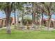 Landscaped common area with fountain, mature trees, and sitting areas at 3002 N 32Nd St # 15, Phoenix, AZ 85018